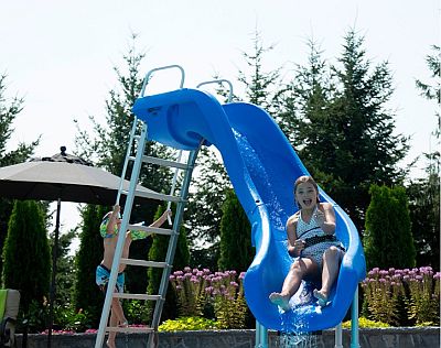 Child sliding on a Rogue 2 Pool Slide